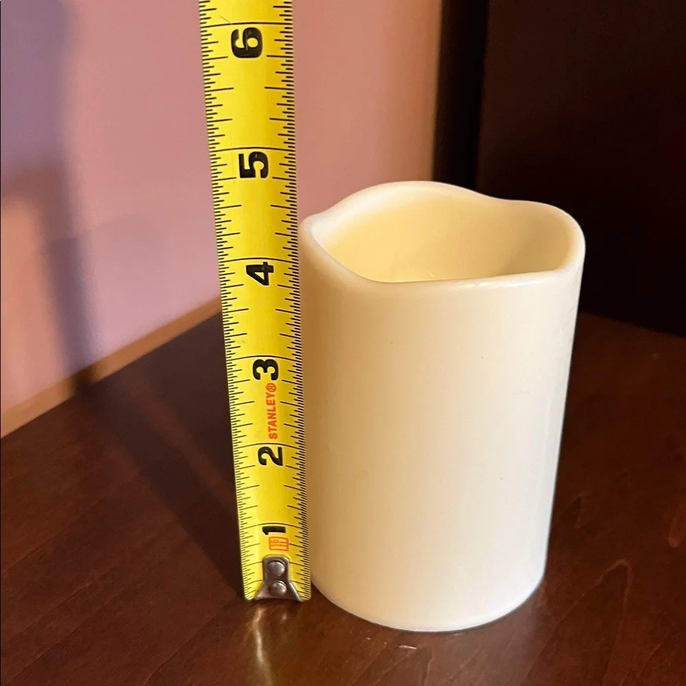 Four  candles — 4 inch cream color battery powered candles.